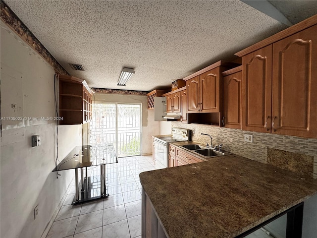 kitchen with backsplash, a textured ceiling, stainless steel electric stove, sink, and light tile patterned flooring