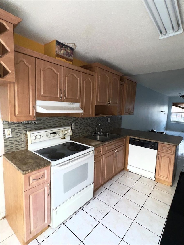 kitchen featuring a textured ceiling, white appliances, ceiling fan, sink, and light tile patterned flooring