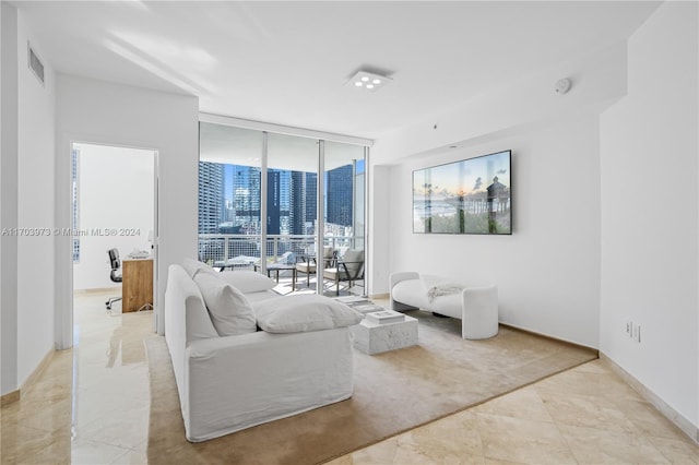 living room with floor to ceiling windows