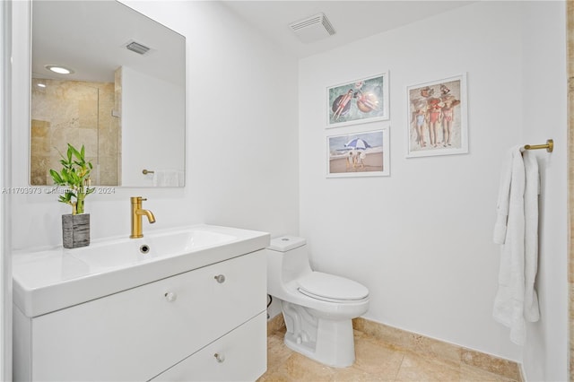 bathroom featuring tile patterned floors, walk in shower, vanity, and toilet