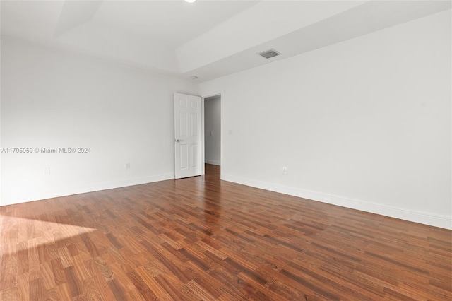 unfurnished room with dark hardwood / wood-style floors