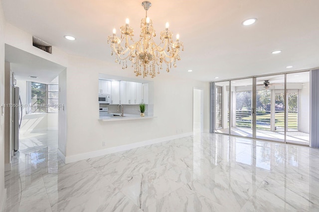 interior space featuring a notable chandelier and sink