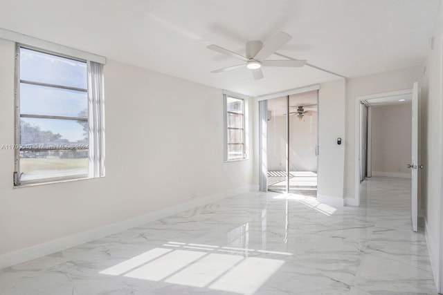 unfurnished bedroom with ceiling fan, multiple windows, and a closet