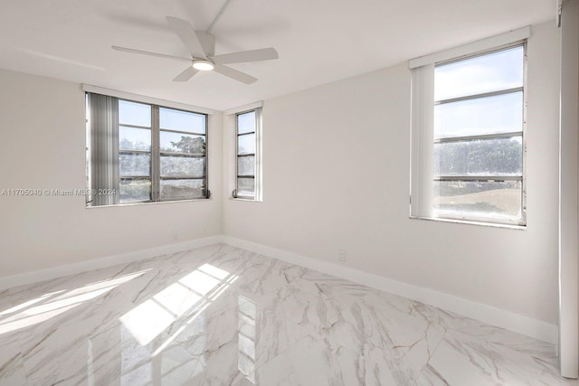 spare room featuring ceiling fan