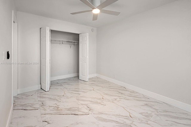 unfurnished bedroom with ceiling fan and a closet