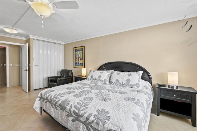 tiled bedroom featuring ceiling fan and crown molding