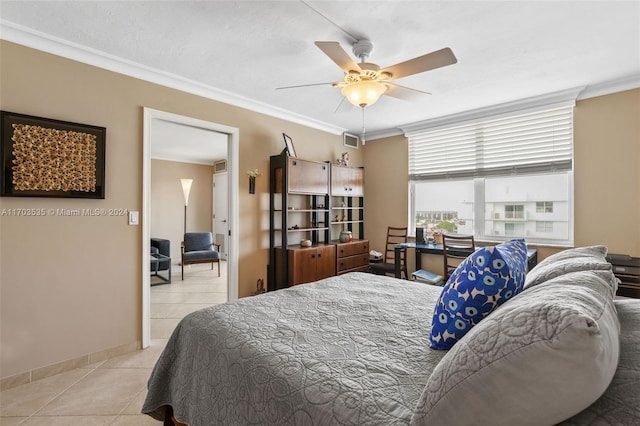 bedroom featuring ceiling fan, crown molding, and light tile patterned flooring