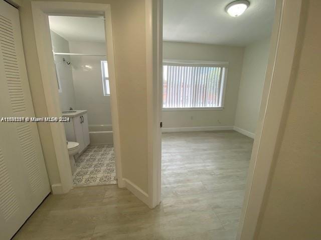 bathroom featuring vanity, toilet, and walk in shower