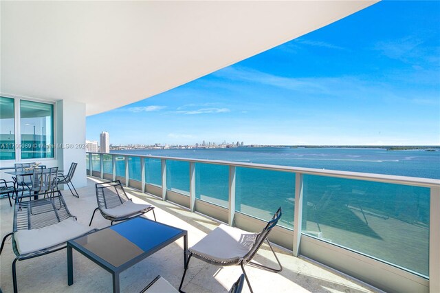 balcony featuring a water view