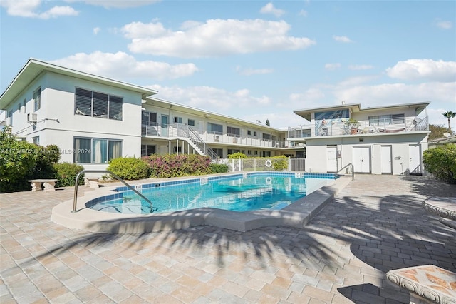 view of swimming pool with a patio area