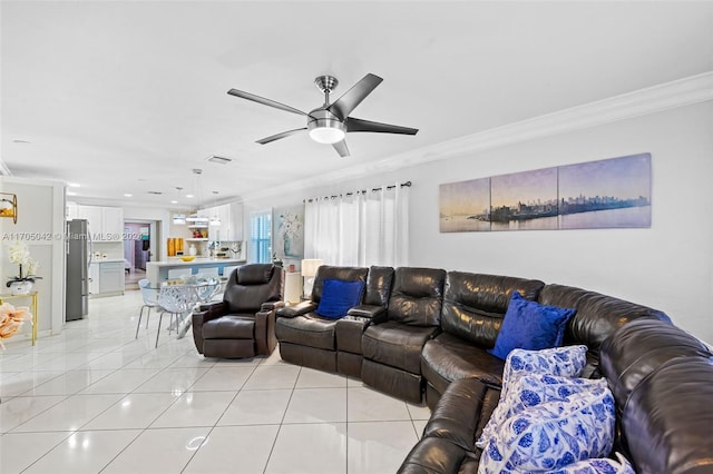 tiled living room with ceiling fan and ornamental molding