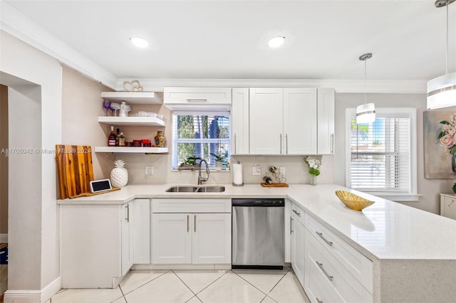 kitchen featuring a wealth of natural light, white cabinetry, dishwasher, and hanging light fixtures