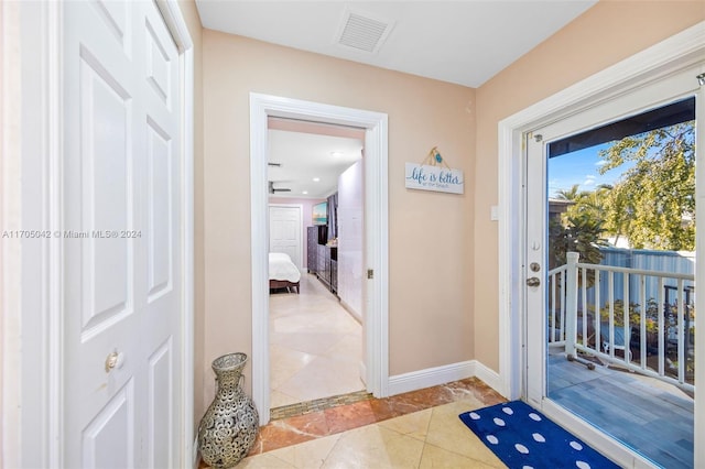 entryway featuring light tile patterned flooring