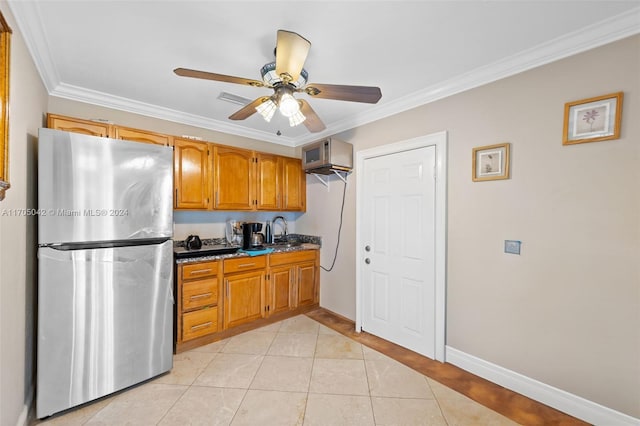 kitchen featuring ceiling fan, sink, stainless steel appliances, crown molding, and light tile patterned floors