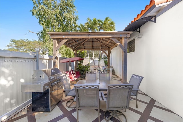 view of patio with a gazebo and a grill