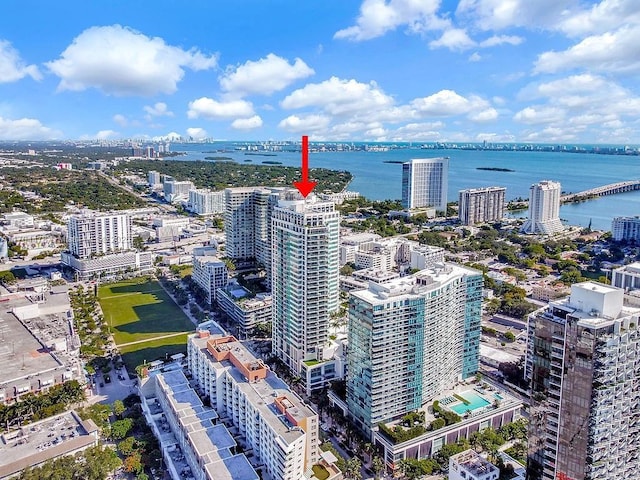 birds eye view of property with a water view