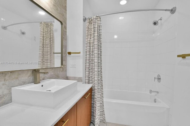 bathroom with vanity and shower / tub combo with curtain