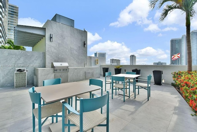 view of patio / terrace featuring sink, grilling area, and exterior kitchen