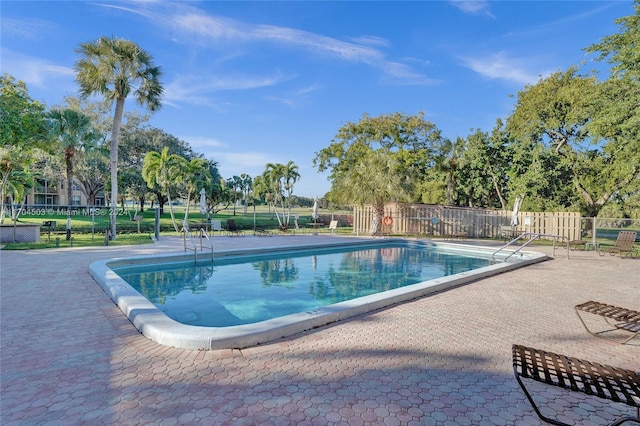 view of swimming pool featuring a patio