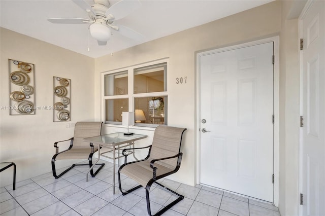 dining room featuring light tile patterned floors and ceiling fan