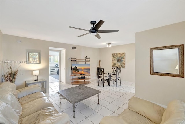 living room featuring ceiling fan and light tile patterned floors