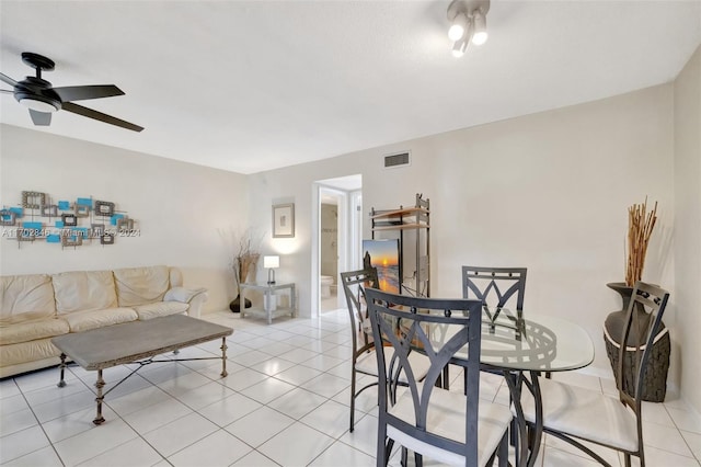 tiled living room featuring ceiling fan