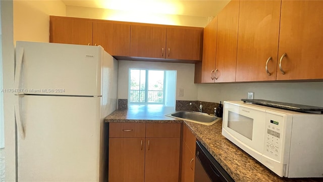 kitchen with white appliances and sink