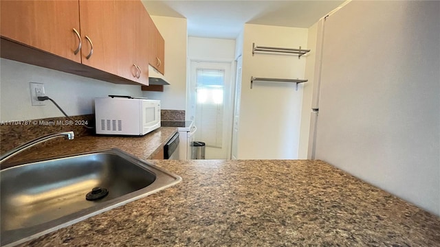 kitchen with appliances with stainless steel finishes and sink