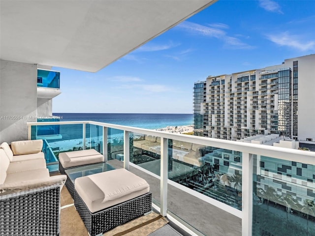 balcony with a beach view and a water view