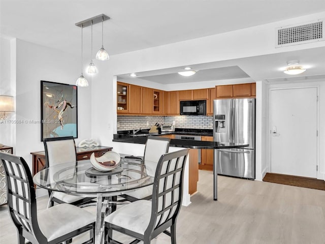 dining room featuring light hardwood / wood-style flooring