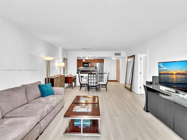 living room with light hardwood / wood-style floors