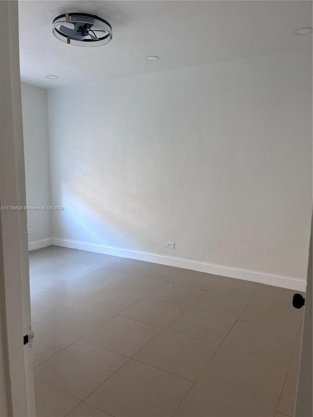 spare room featuring tile patterned floors