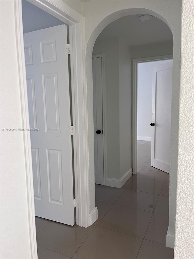 corridor featuring tile patterned floors