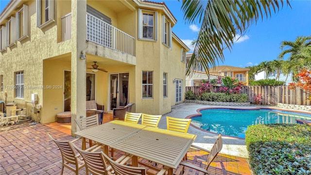 view of pool featuring a patio and ceiling fan