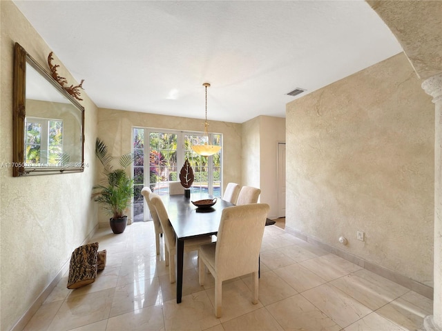 dining room featuring a wealth of natural light