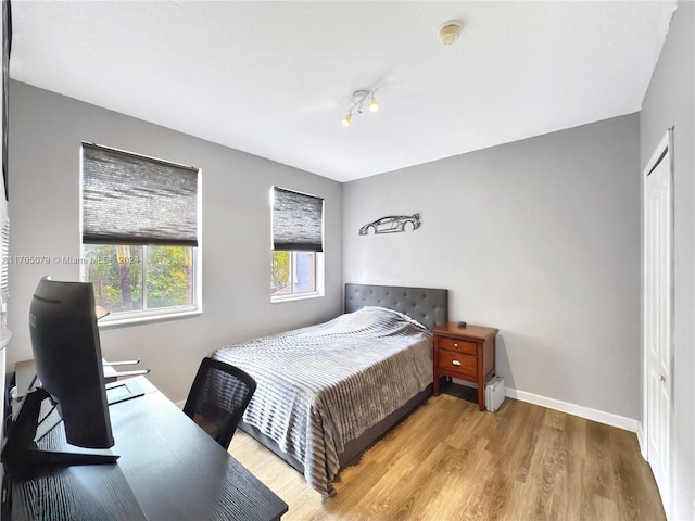 bedroom with a closet and light wood-type flooring