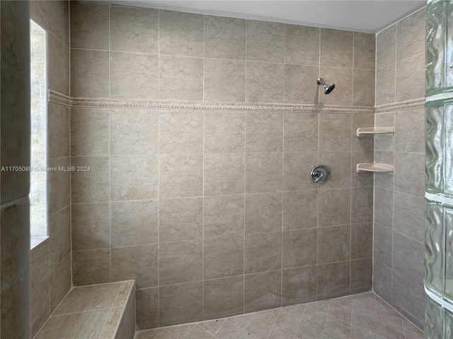 bathroom with tiled shower