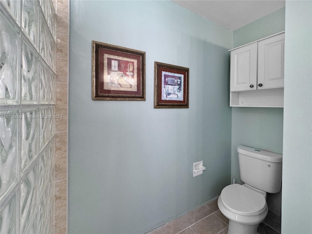 bathroom featuring tile patterned flooring and toilet