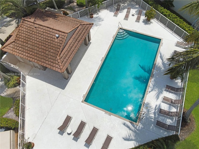 view of swimming pool with a patio area