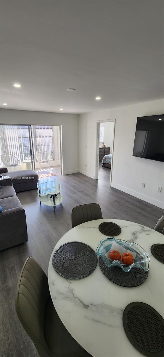 living room with dark hardwood / wood-style floors