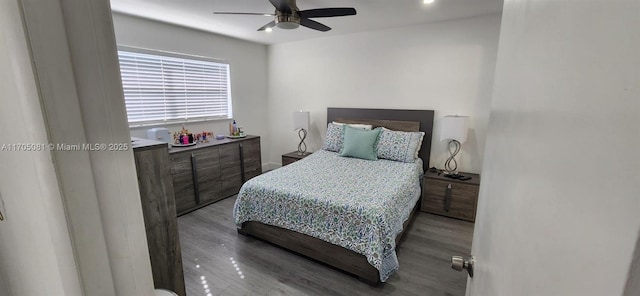 bedroom featuring ceiling fan and hardwood / wood-style floors