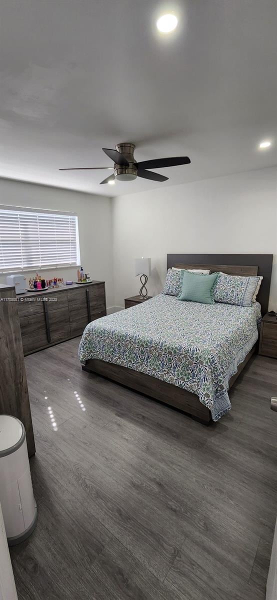 bedroom with a ceiling fan and wood finished floors