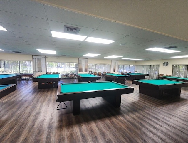 recreation room with a paneled ceiling, dark hardwood / wood-style floors, and billiards