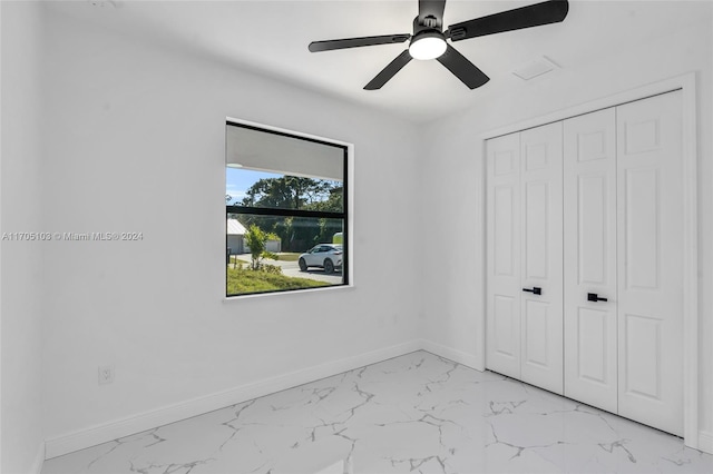 unfurnished bedroom with a closet and ceiling fan