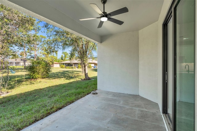 view of patio featuring ceiling fan