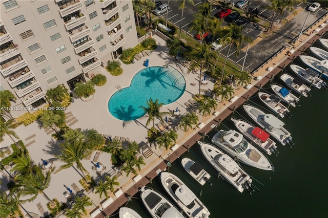 birds eye view of property with a water view