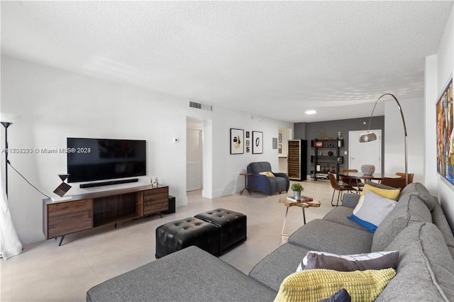 living room featuring a textured ceiling