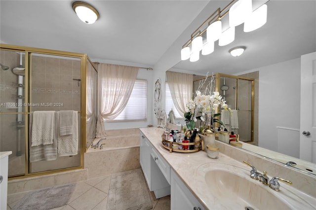 bathroom with tile patterned flooring, vanity, and plus walk in shower