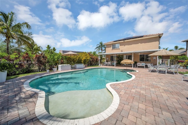 view of swimming pool featuring a patio