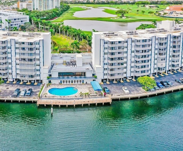 birds eye view of property featuring a water view